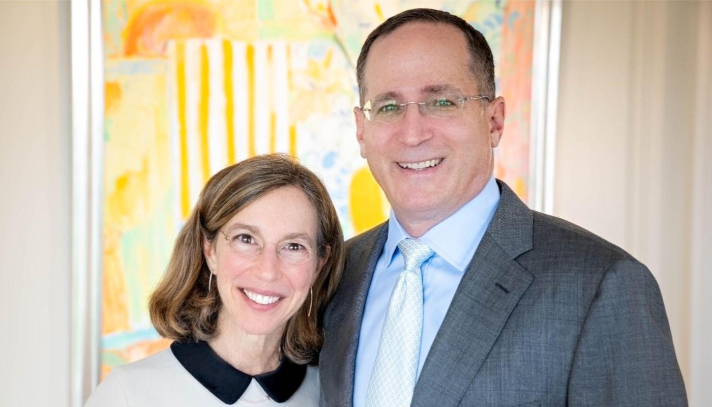 Jeannie and Jonathan Lavine pictured together, with one arm around the other